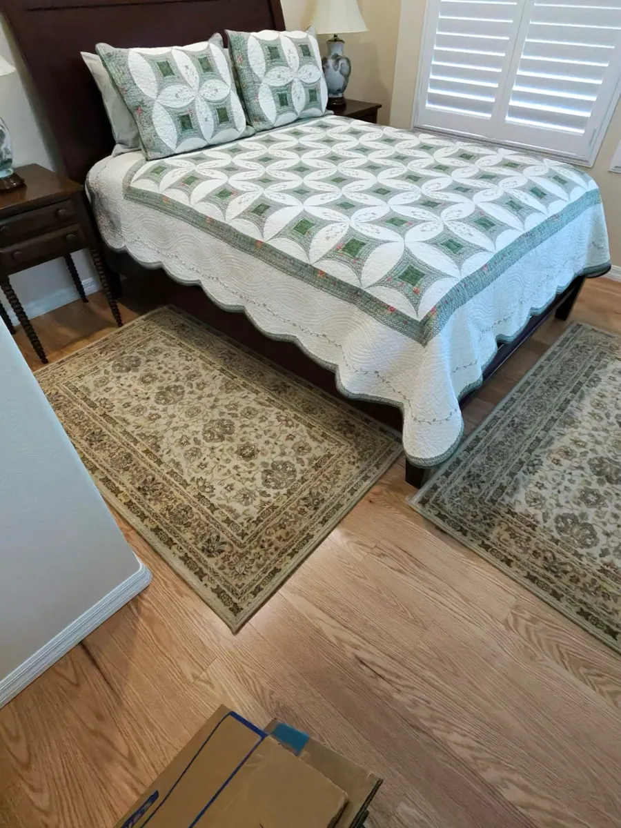 After: Anthem bedroom with wood flooring back in place and furniture set up