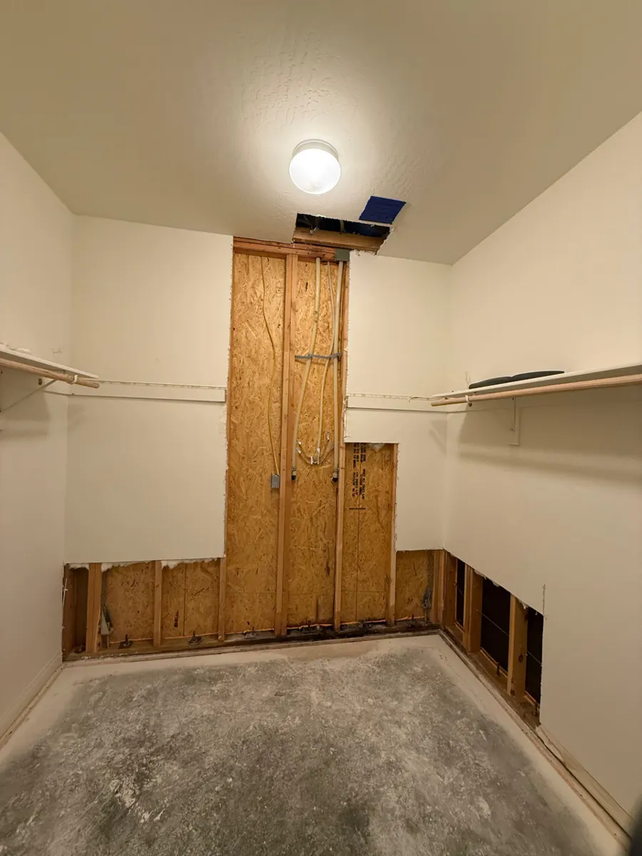 Closet walls opened to the framing after water damage in a Cadence home in Henderson