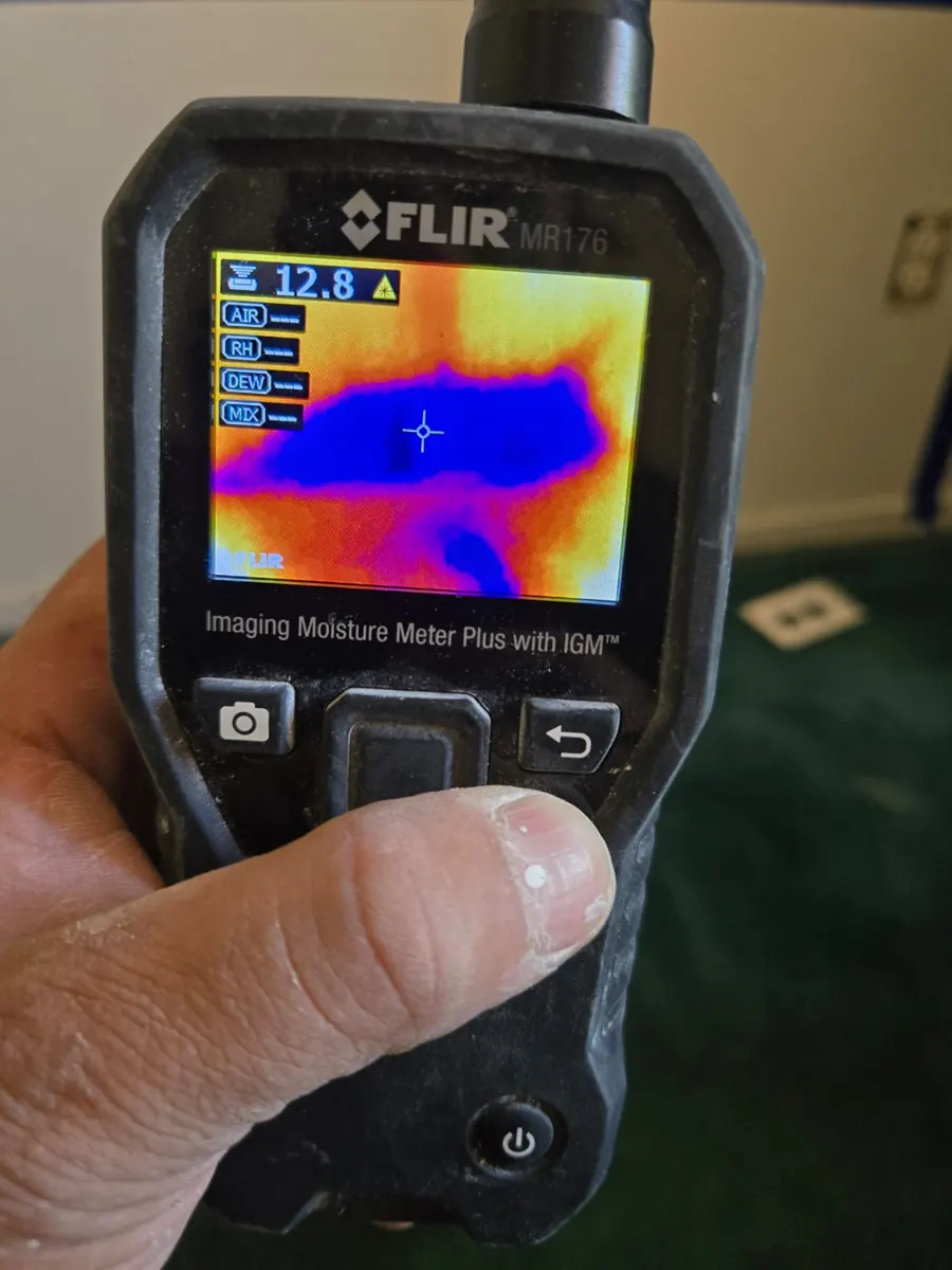 Thermal moisture meter screen showing a wet area on a wall in a Foothills home