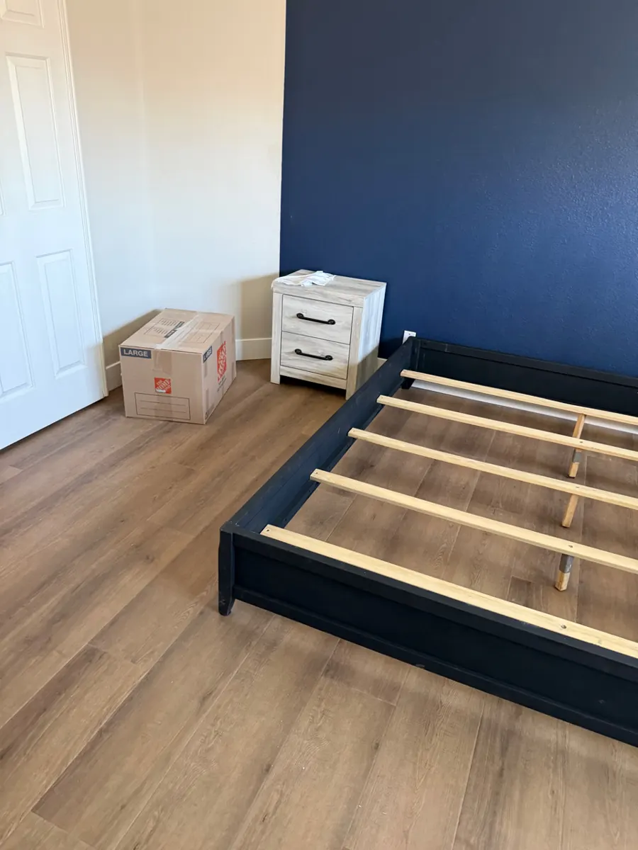 After: bedroom with new plank flooring in a Green Valley North home