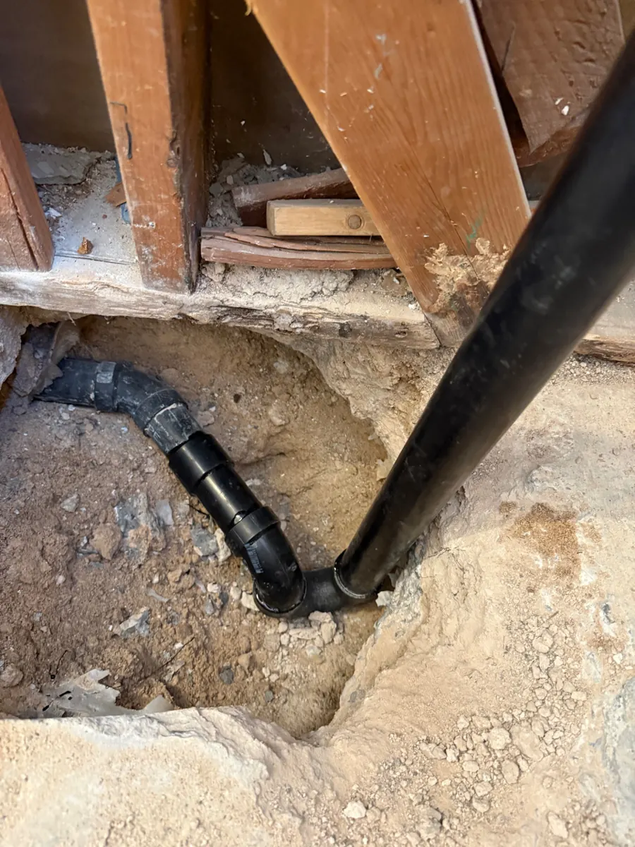 Slab opened with a new drain line for a walk-in tub in a Green Valley North bathroom