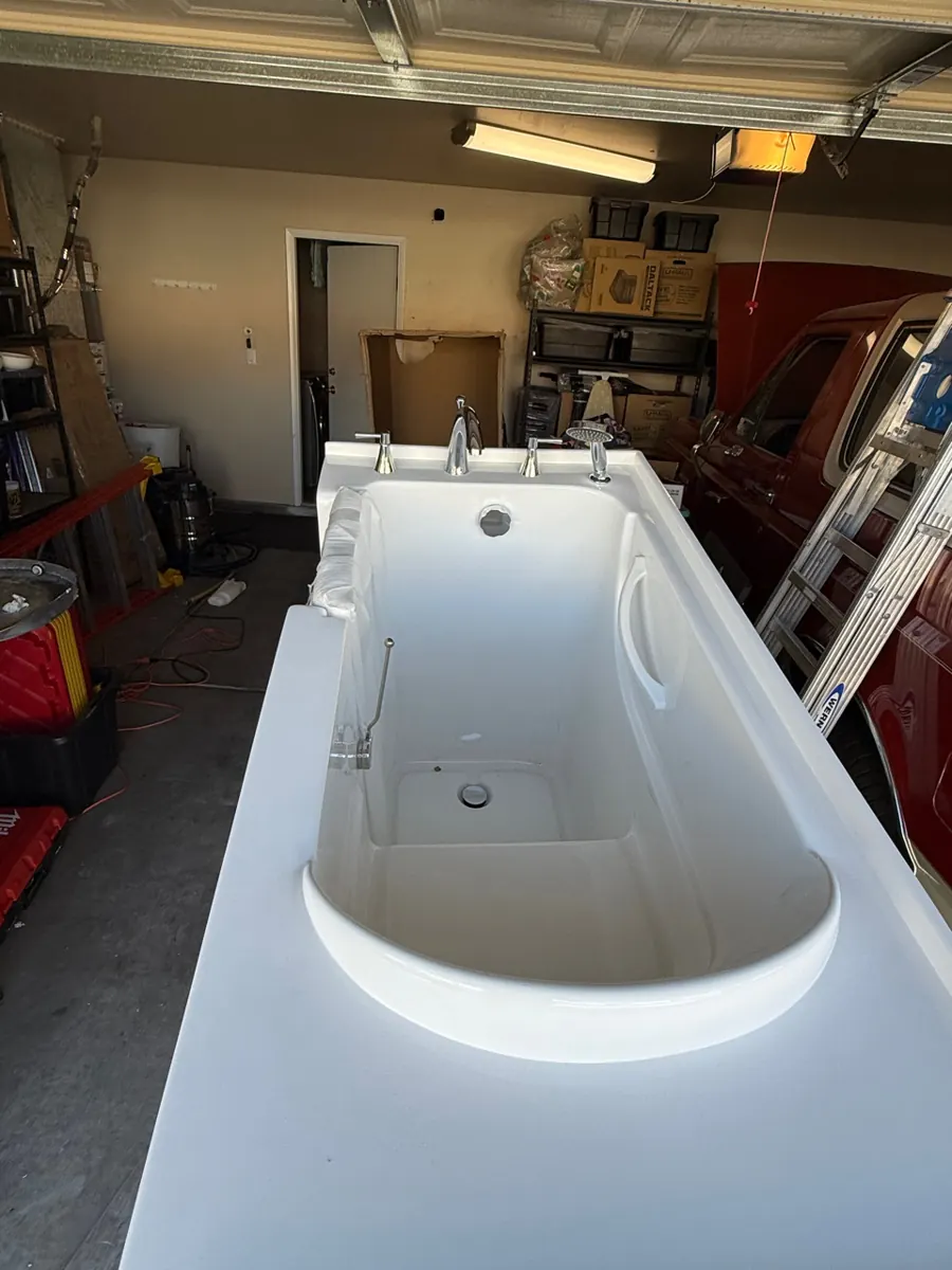 Walk-in tub staged in the garage before installation in a Green Valley North home
