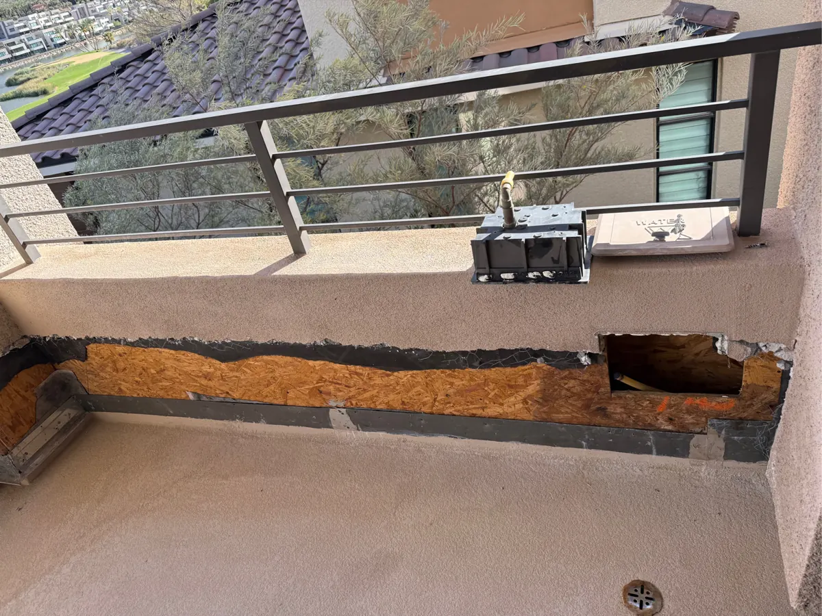 Balcony wall with stucco removed to the sheathing at a Lake Las Vegas home