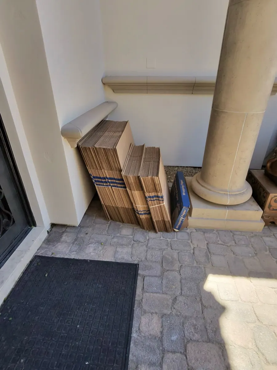 Moving boxes staged at the entry for a contents pack-out in MacDonald Ranch