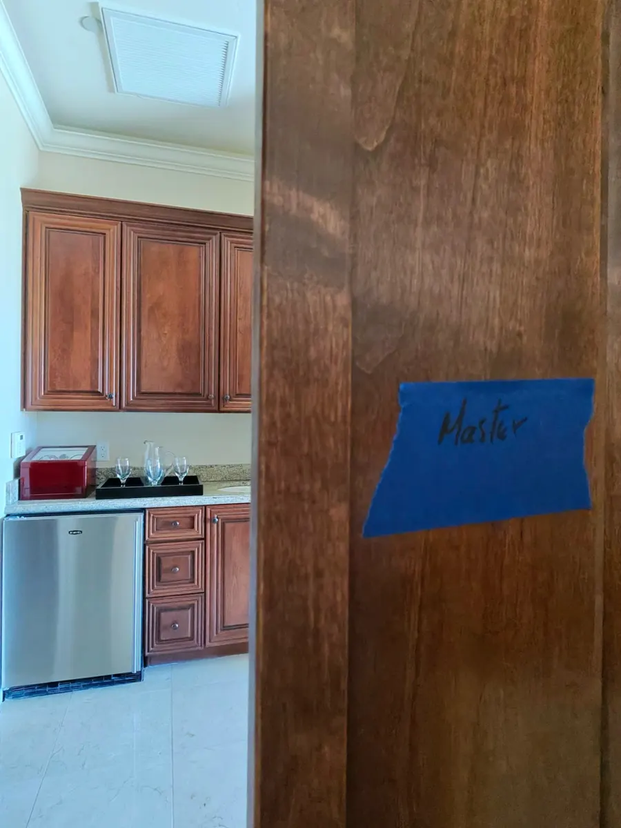 Door labeled with blue tape during a contents pack-out in a MacDonald Ranch home
