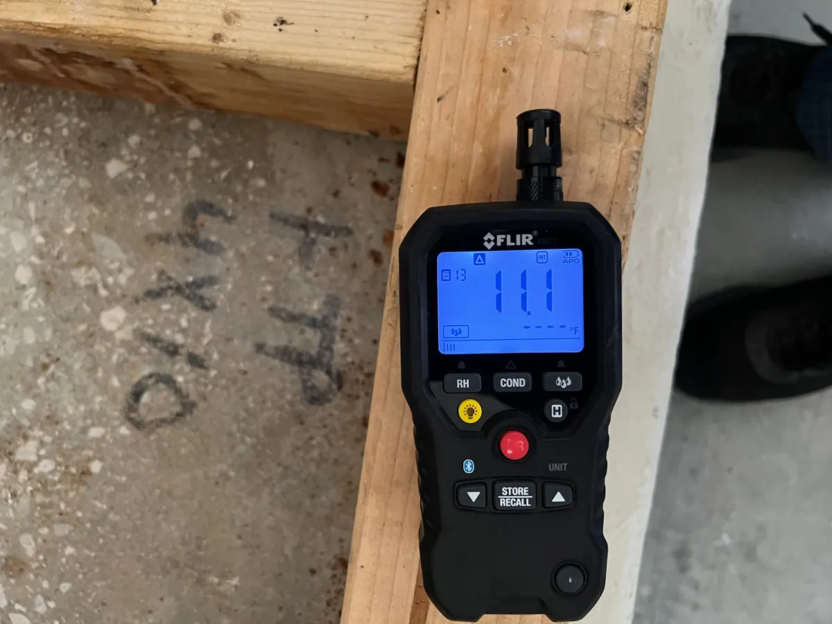 Moisture meter reading on exposed wood framing at a McCullough Hills water job