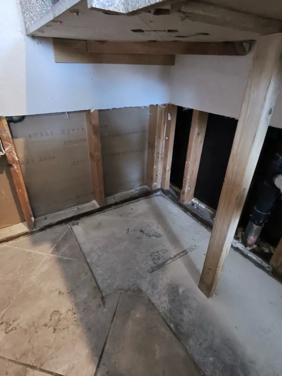 Kitchen wall opened to studs where base cabinets were removed in a Northwest Las Vegas home