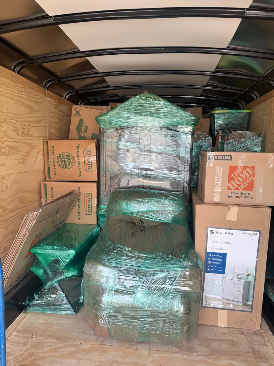 Enclosed trailer loaded with wrapped furniture and boxes from a Pittman home