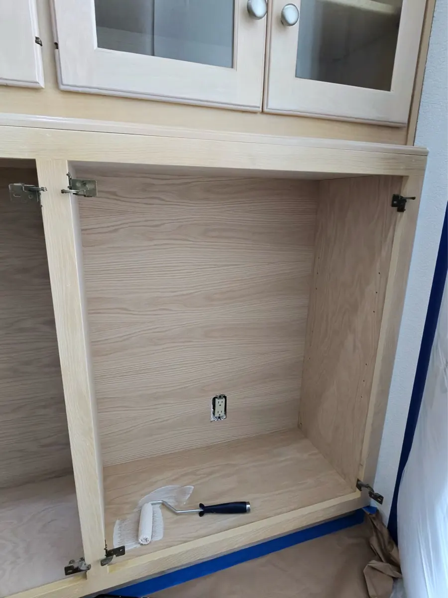 New built-in cabinet box being finished under glass-front uppers in a Spring Valley home