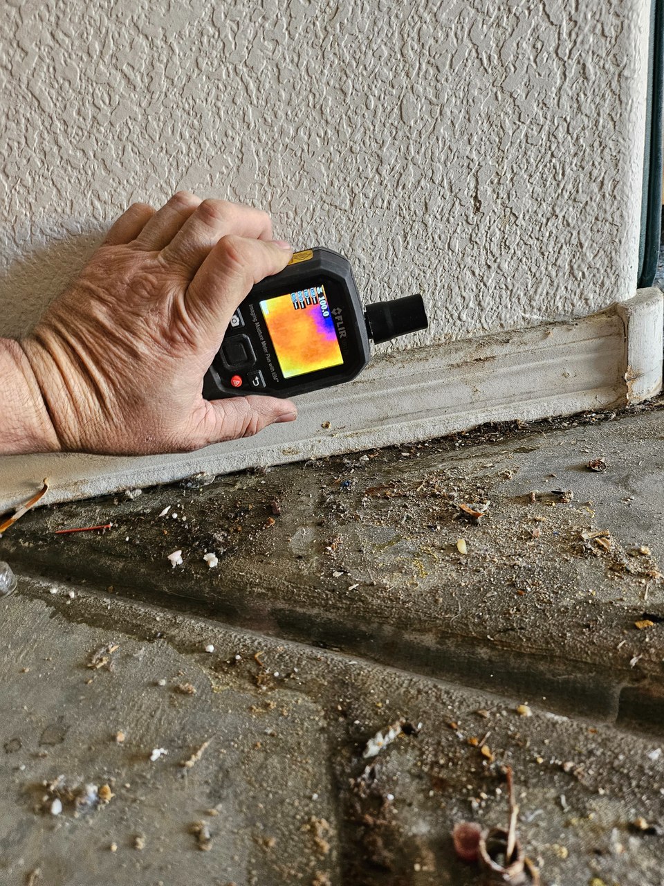 Thermal imaging moisture meter used at a wall in a Sun City Summerlin home