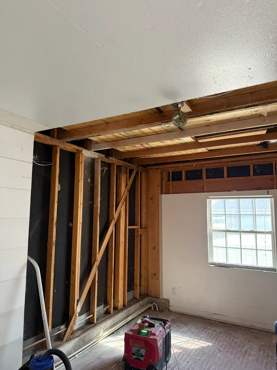 Room with wall drywall and part of the ceiling removed to the framing in West Sahara