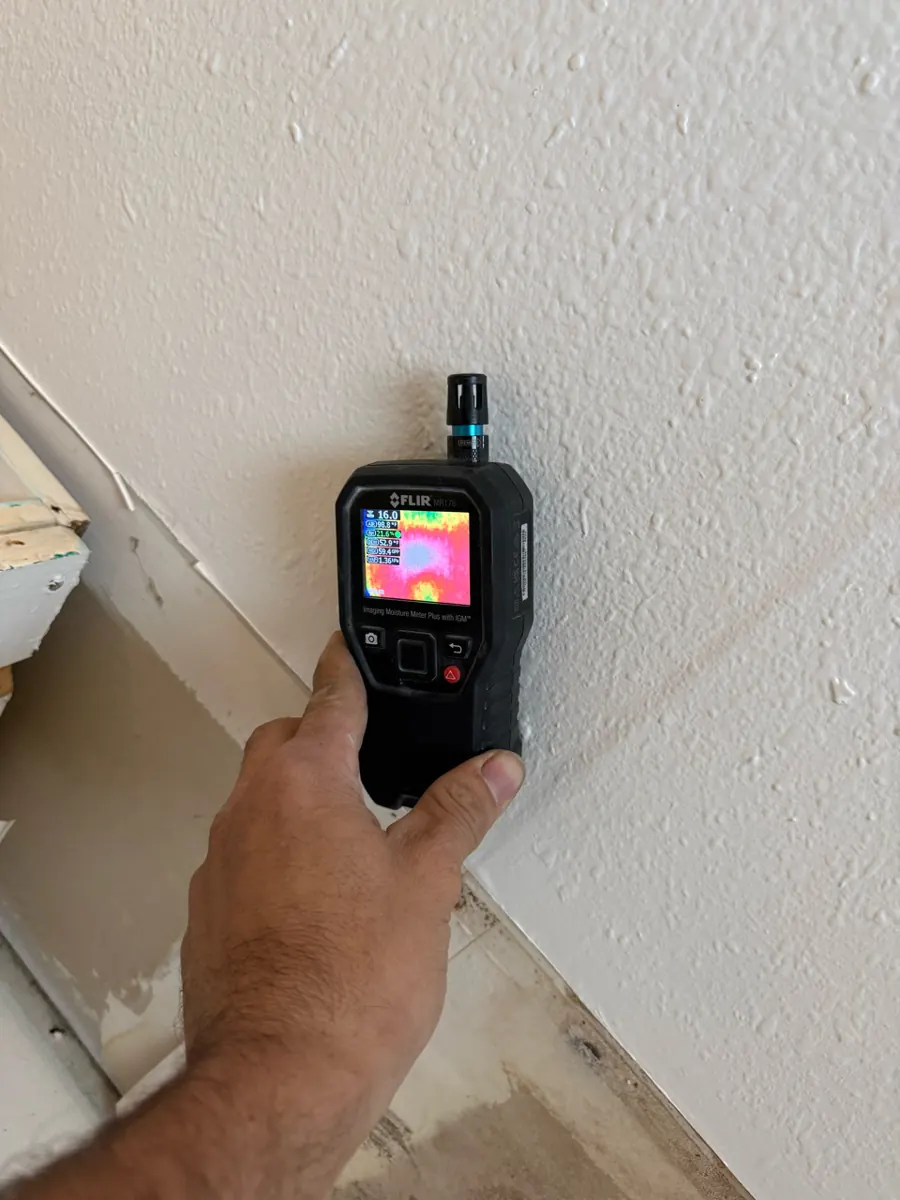 Thermal moisture meter reading taken at the base of a textured wall in a West Sahara home