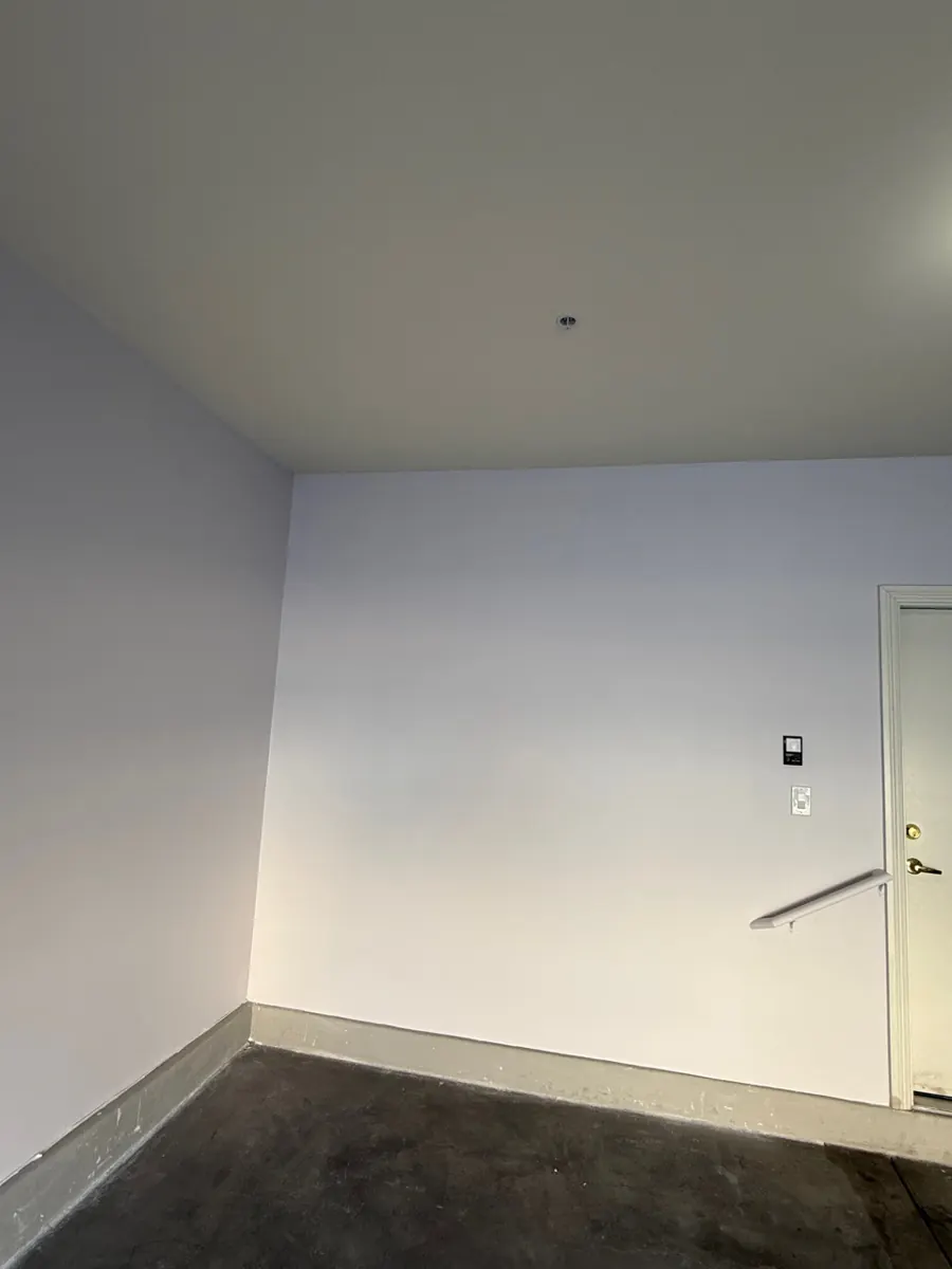 Finished, painted garage walls and ceiling after rebuild in Whitney