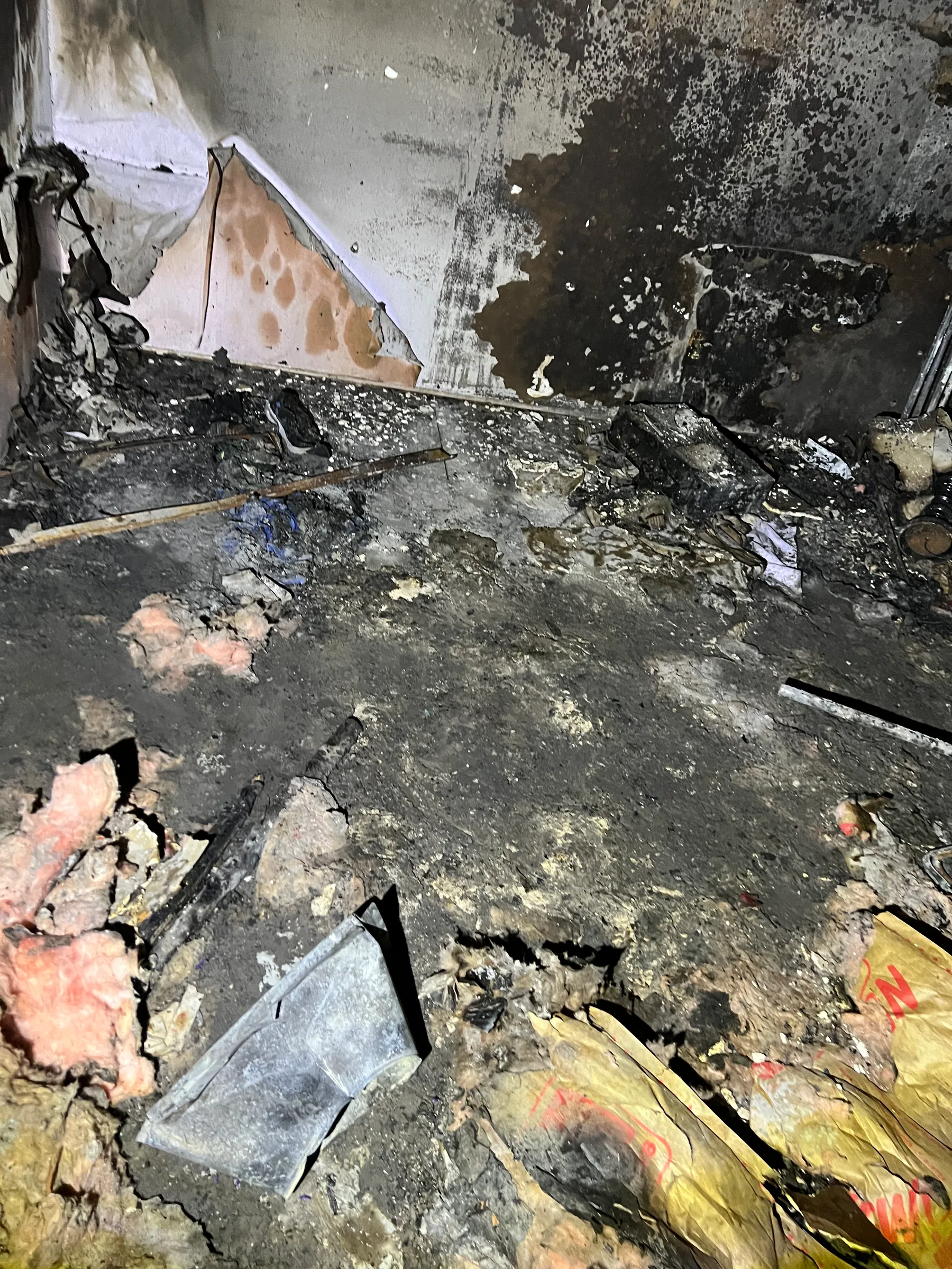 Burned room with damaged contents before fire damage debris removal
