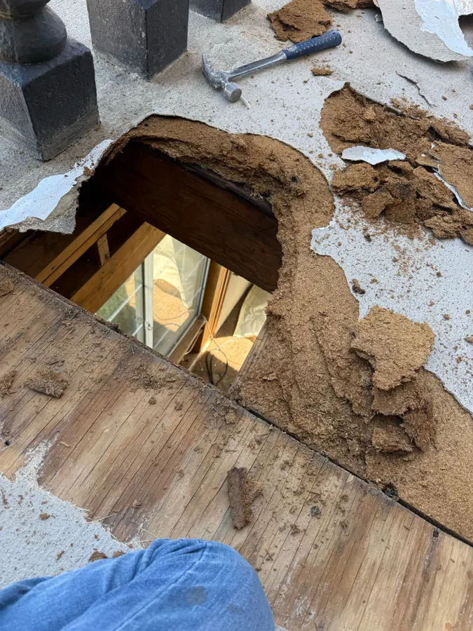 Wet balcony plywood opened up, with the room below visible through the hole