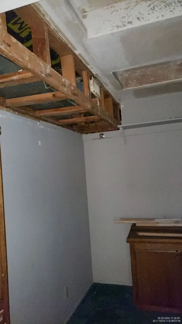Water damage from an appliance leak showing through ceiling drywall in a Henderson home