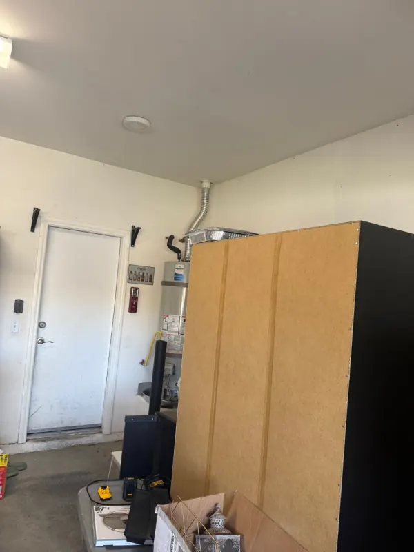 Crawl space cleaning equipment under a Henderson home