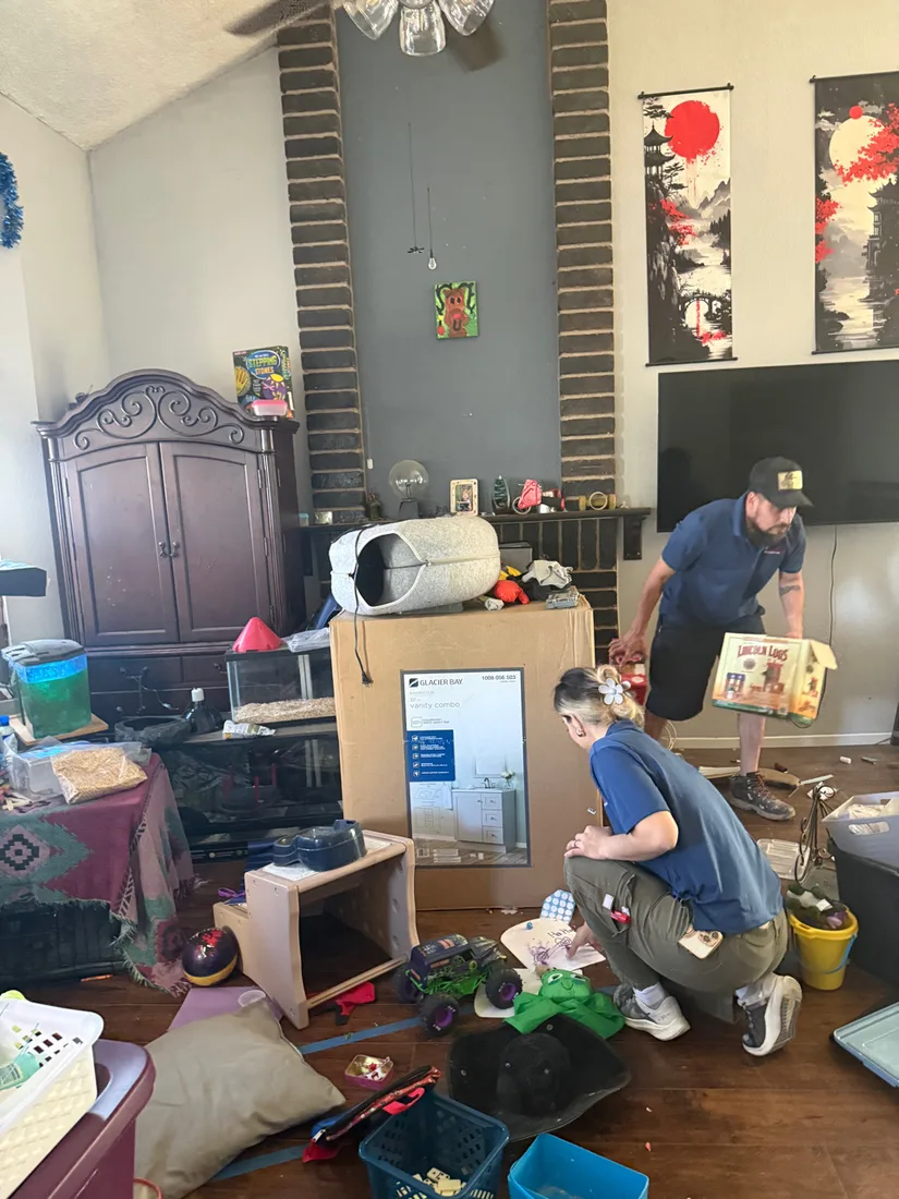 Cleanup crew sorting belongings during a specialty cleaning and hoarding restoration project in Henderson